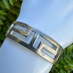 Silver tone cut out open cuff bracelet